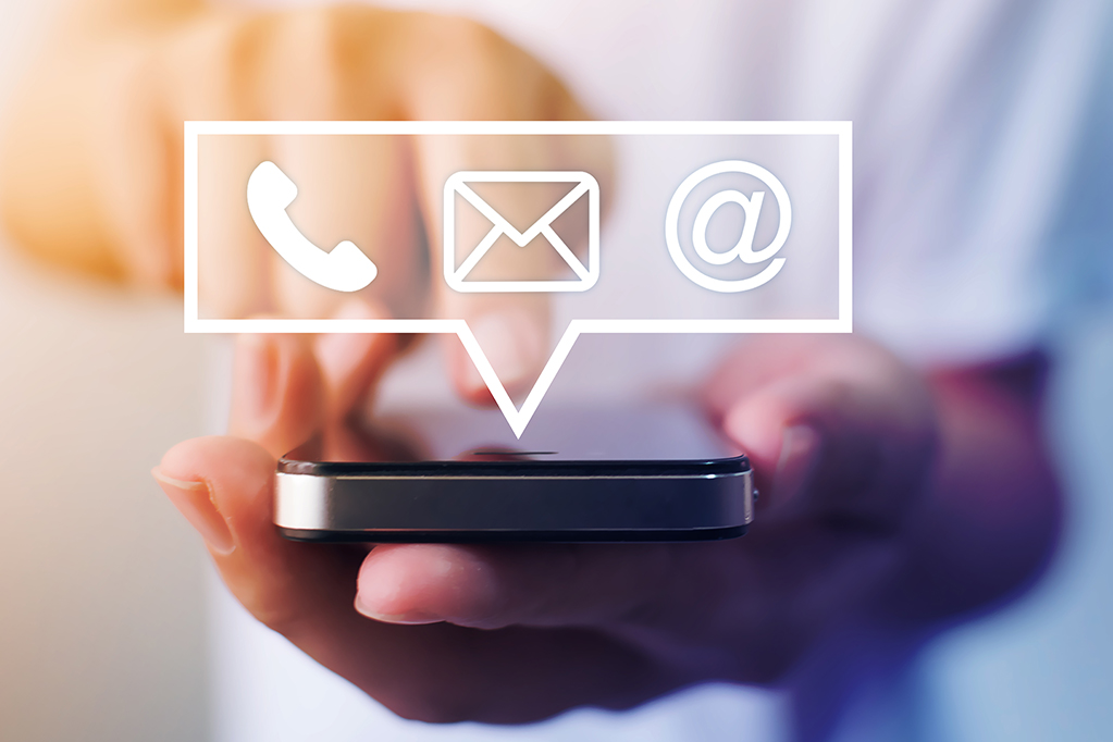 Close-up image of male hands using smartphone with icon telephone email mobile phone and address